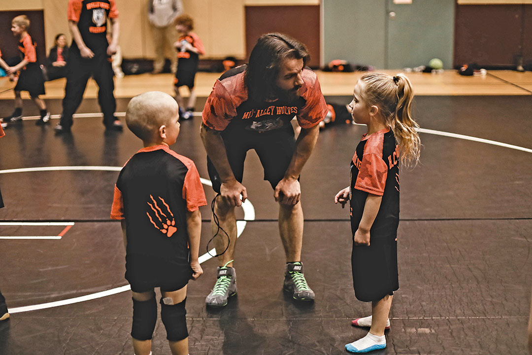 Coach Ekle with young wrestlers 